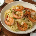 Red Lobster-style shrimp scampi with succulent shrimp, buttery garlic sauce, and al dente angel hair pasta.